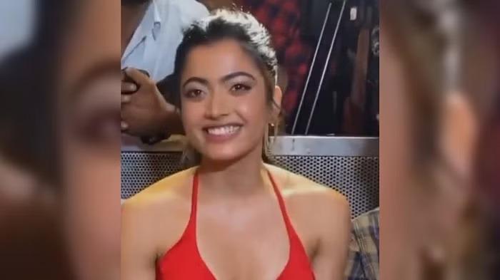 Rashmika wearing a red dress